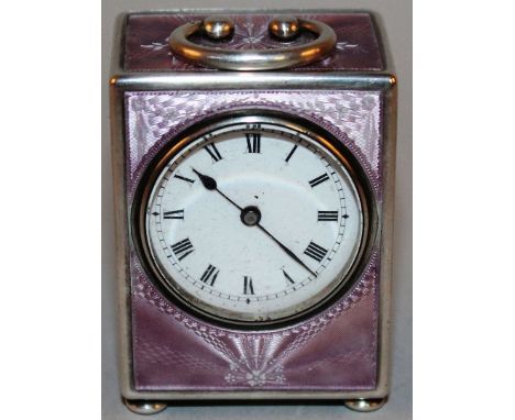 A LOVELY SMALL CONTINENTAL SILVER AND ENAMEL CLOCK 2ins high.