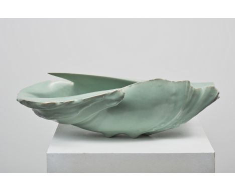 JEAN-FRANCOIS FOUILHOUX (Né en 1947)MéandreCéramique à glaçure céladonH: 17cm.(6.69in.); L: 53cm.(20.87in.); P: 31cm.(12.20in