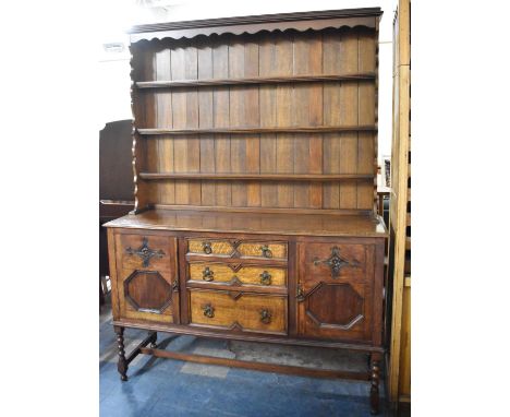 A Mid 20th Century Oak Dresser the Base Section with Three Graduated Centre Drawers Flanked by Cupboards, Three Shelf Plate R