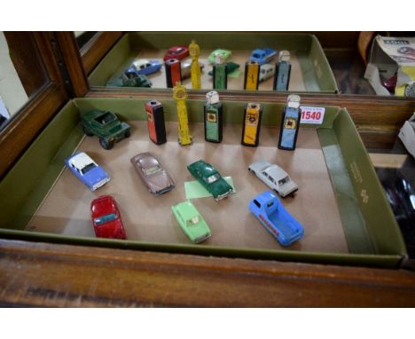 A small quantity of Lesney vehicles; together with vintage petrol pumps; and a Dinky Scout car. 
