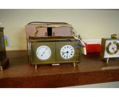 A vintage brass combination clock and barometer desk set, of oval section, with bowed and bevelled glass and enamel dials, 17