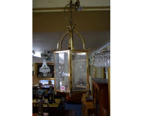 An old chandelier and a reproduction brass hexagonal lantern. 