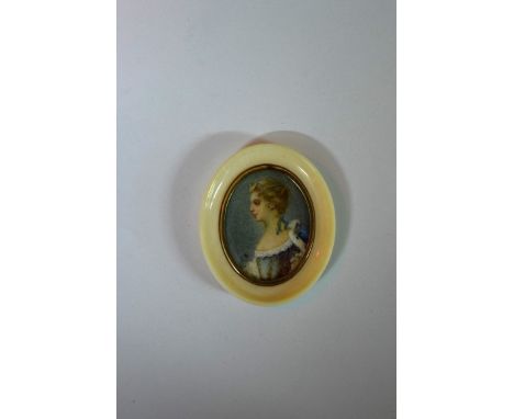 An ivory framed portrait miniature of a lady, initialled 'CB', the whole 5 x 4.2cm. 