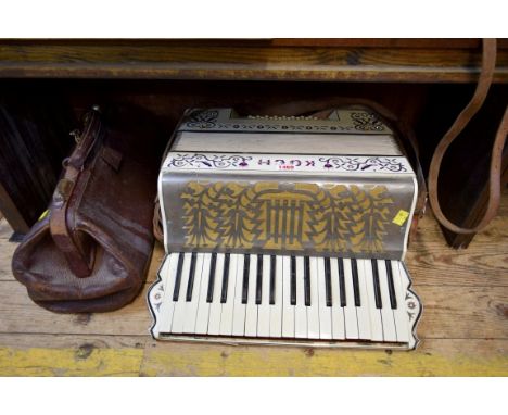 A Koch piano-accordion; and a vintage GPO leather gladstone bag. 