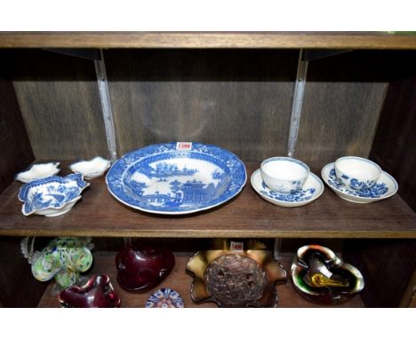 Two Worcester first period tea bowls and saucers; together with a pair of late 18th century English porcelain leaf shape pick