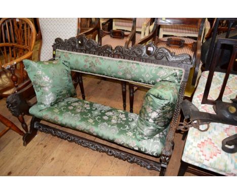 A late 19th century carved oak and upholstered hall bench, 122cm wide. 
