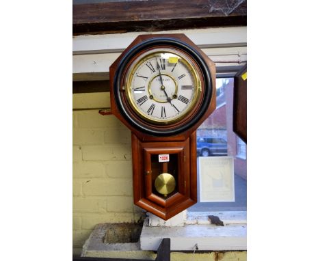 A reproduction octagonal drop dial wall clock, with enamel dial, 31cm wide. 