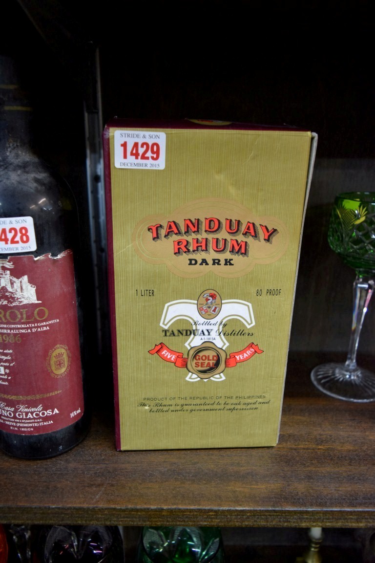 A 1 litre bottle of Tanduay Rhum, in card box.