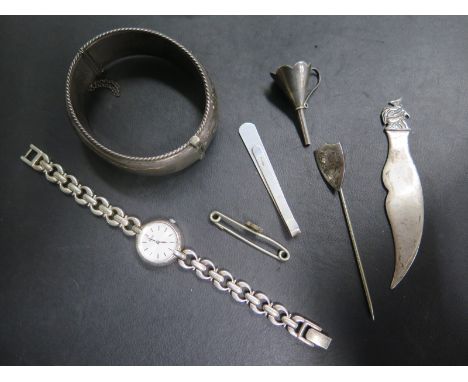 A mixed silver lot consisting of a silver bangle with gold decoration, silver ladies watch, perfume funnel - total weight app