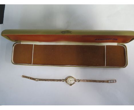 A ladies Giffron 9ct manual wind wristwatch with 9ct hallmarked bracelet strap, total weight approx 16 grams, not working, ca