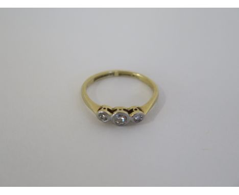 An 18ct gold and platinum three stone diamond ring, approx 1.9 grams, size K, with insurance valuation for £495, diamonds bri