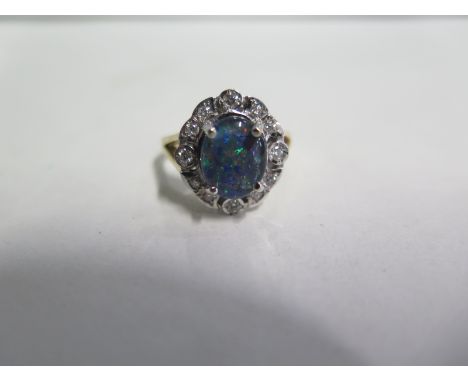 An 18ct yellow gold Opal triplet and diamond ring, size O/P - in good condition 