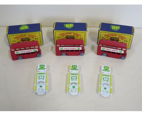 Four boxed Moko Lesney London buses No 5 - and three BP map mileometers - all good condition, minor marks to one bus 