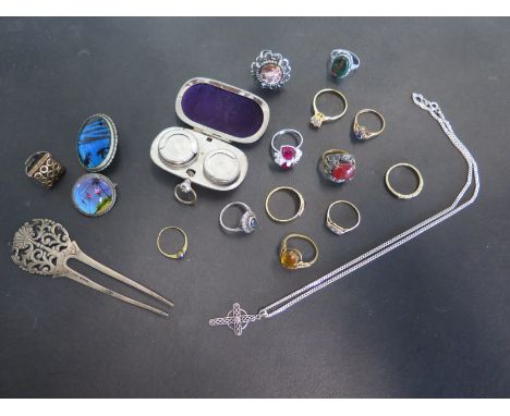 An assortment of costume jewellery and an 18ct diamond ring, broken - a silver hair grip and a base metal sovereign case, 18c