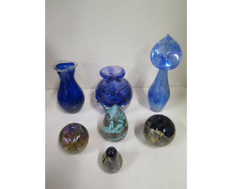 A collection of seven pieces of Isle of Wight and similar style glass vases, four paperweights and three vases, most in good 