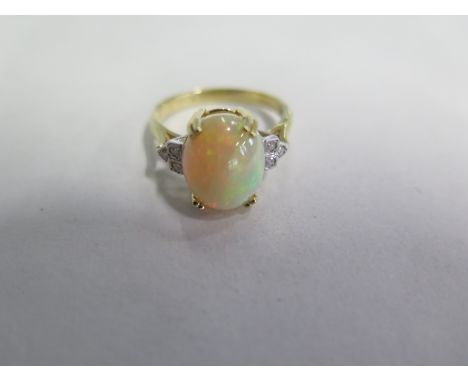 An 18ct yellow gold opal and diamond ring, size O/P - in good condition 