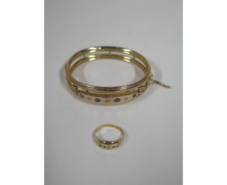 A 9ct gold bangle with diamonds, a sapphire and three blue stones, approx 11.3 grams, approx 6.5cm oval, together with an 18c