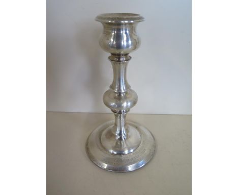 A silver presentation candlestick with weighted base, 24cm tall, Birmingham 1907/08 some denting mainly to base otherwise gen