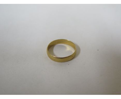 A 22ct gold ring, approx 2.7 grams, size M, in good condition but with some surface wear 