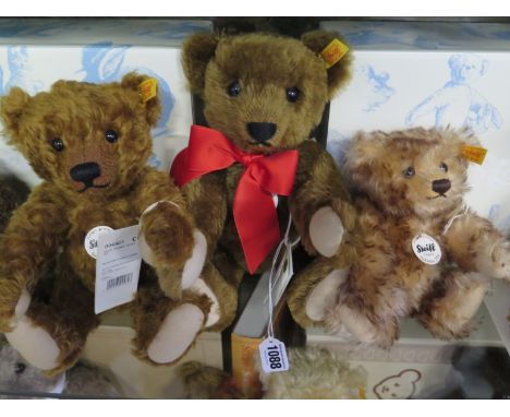 Three Steiff teddy bears 1905 replica in chestnut, approx 30cm, a 1926 Happy Bear Replica, approx 22cm high and a 1909 Replic