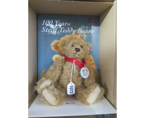A Steiff Bear with 100 years of Steiff teddy bears book - 25cm tall, mohair - limited edition number 136 of 1902 - in good co
