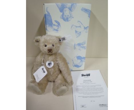 A Steiff 1934 Replica Bear - 30cm tall, mohair - limited edition number 156 of 1000 - in good condition with original box and