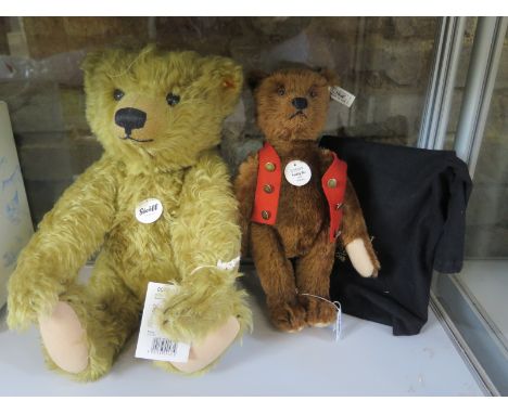 A Steiff Teddy Bu 1925 replica limited edition number 2479 of 4000 with bag, also a classic style brass coloured teddy approx