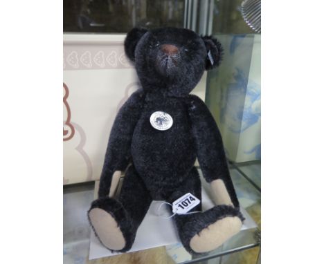 A Steiff 1908 Replica Bear Black - 35cm tall, mohair - limited edition number 1904 of 3000 - makes noise when moved - in good