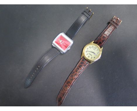 A vintage Zurich manual wind digital jump hour wristwatch, 37mm wide including button, and a Lorus Lumbrite wristwatch, both 