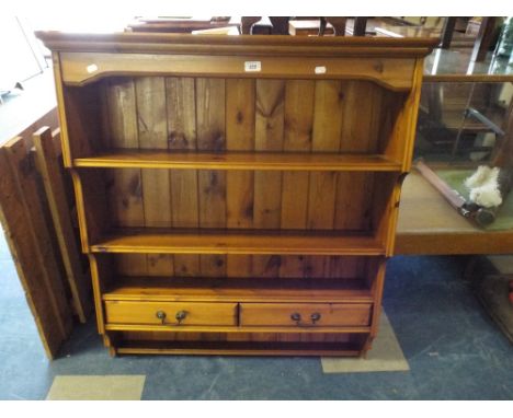 A Wall Hanging Pine Kitchen Shelf Unit with Two Drawers.