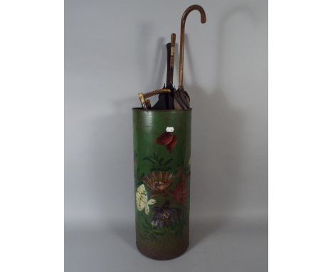 A Late Victorian Painted Metal Stick Stand Containing Parasols, Umbrellas and Riding Crop. 