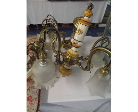 Two Brass Wall Lights and A Brass and Ceramic Chandelier.