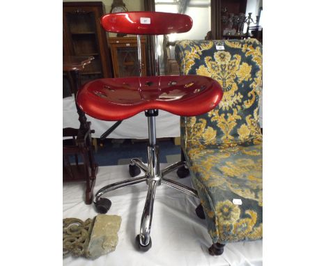 A Vintage Style Chrome and Red Enamelled Swivel Chair. 