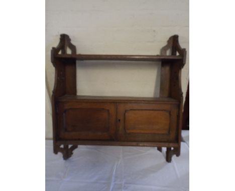 A Wall Hanging Edwardian Oak Shelf with Base Cupboard. 
