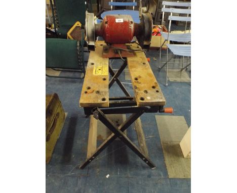 A Workmate and Two Wheel Grinder.