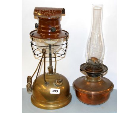 A copper oil lamp and Tilley lamp.