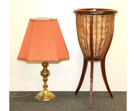 An Edwardian basket and a brass table lamp.