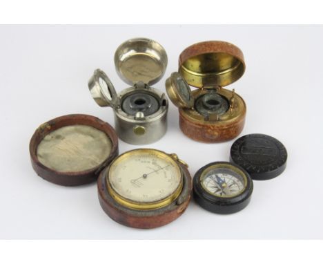 Two 19th Century travelling inkwells, a travelling barometer and a bakelite cased compass.