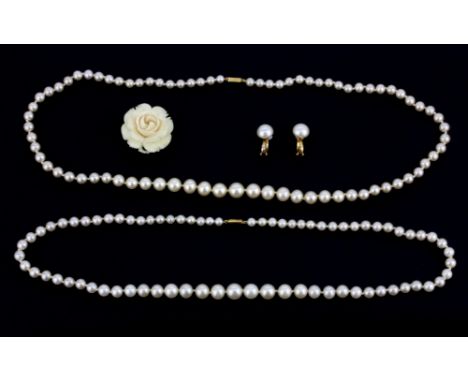 Two strands of vintage graduated faux pearl necklaces on 9ct gold clasps with a pair of Ciro earrings and carved ivory brooch