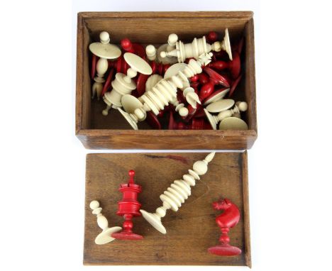 An antique turned and dyed ivory chess set, King H. 9cm.