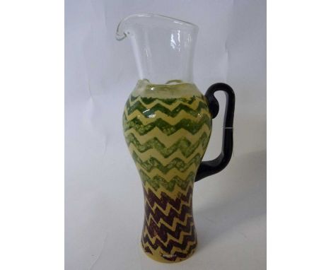 A Kosta Boda ewer decorated in the safari pattern signed by K Jellengman, 32cm high