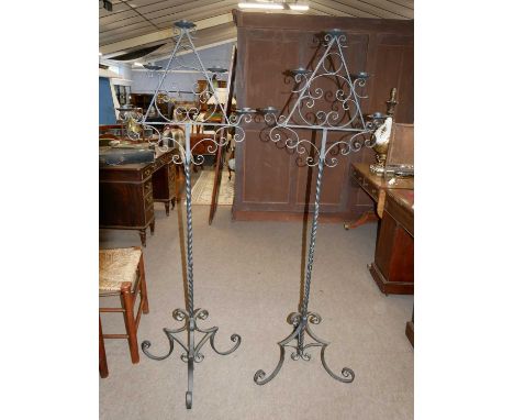 A pair of 20th Century iron floor standing five light candelabra with scrolled decoration and twist columns, 159cm high