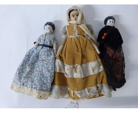 Plastic bag containing three vintage dolls