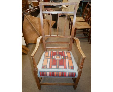 A 19th Century oak and elm framed armchair with contemporary geometric tapestry seat