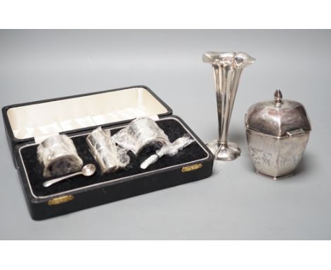 A George V silver hexagonal tea caddy, Sheffield, 1919, 10.5cm, a silver posy vase and a cased three piece silver condiment s