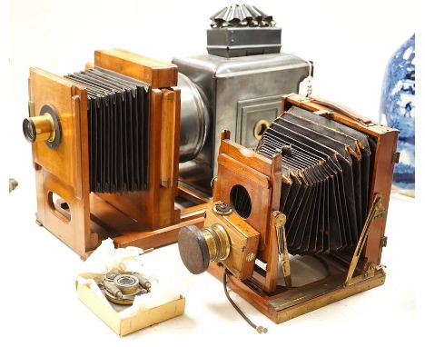 An early 20th magic lantern and a bellows camera,Magic lantern 51 cms wide.