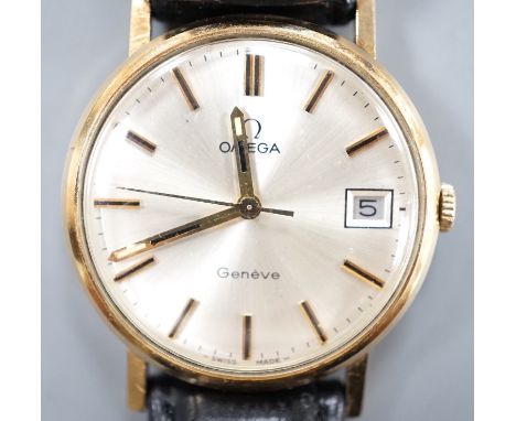 A gentleman's 9ct gold Omega manual wind wrist watch, with date aperture, on a black leather Omega strap with Omega buckle, c