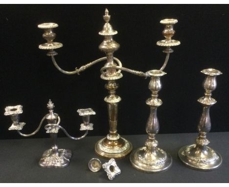 An E.P on Copper. three light two branch table candelabrum, 51cm high;  a pair of similar candlesticks;  tc 