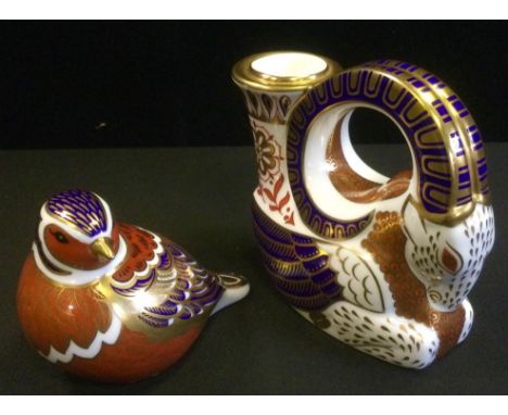 A Royal Crown Derby Imari ram candlestick;  a Wren paperweight, gold stopper (2) 