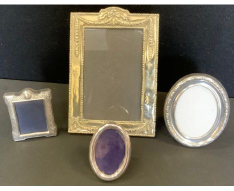 A silver oval easel photograph frame, 10.5xm z 8.5cm;  others;  an EPNS rectangular photograph frame (4) 